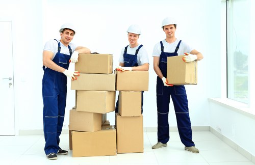 Professional movers loading office items for a Chinatown business relocation