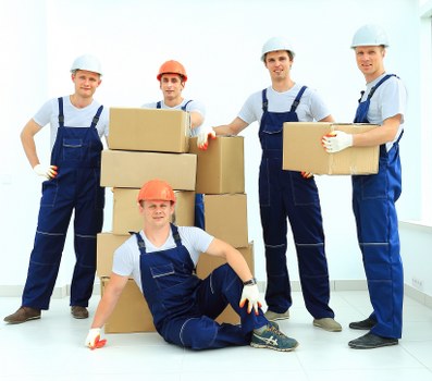 Local movers handling furniture for a Chinatown flat move