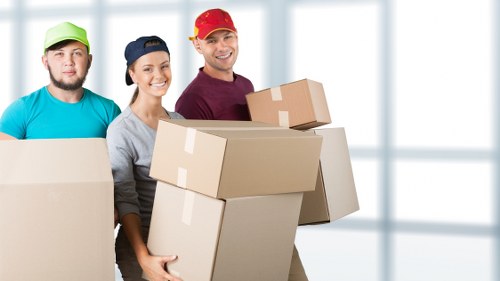 Commercial moving crew preparing office items for a Chinatown relocation