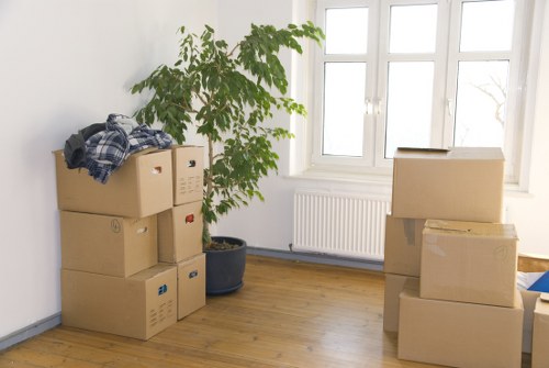 Packers handling boxes and furniture for a Chinatown apartment