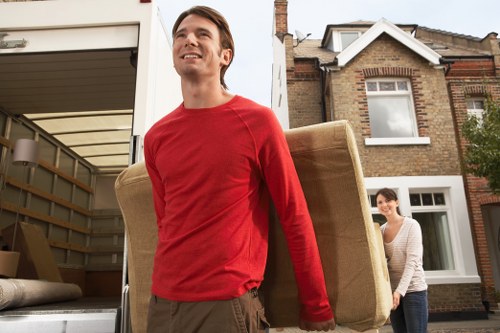 Team moving office furniture in a mixed-use Chinatown building