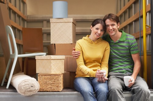 Moving team handling furniture carefully during a house move