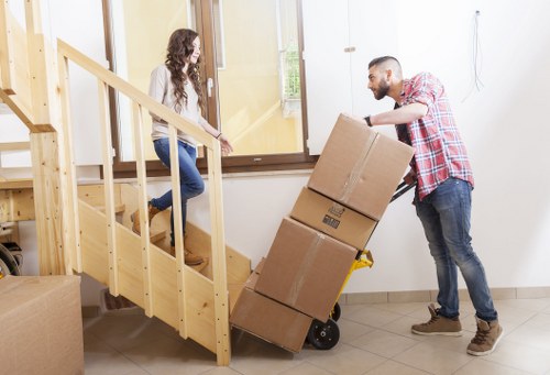 Local movers preparing boxes and furniture for a Chinatown home relocation