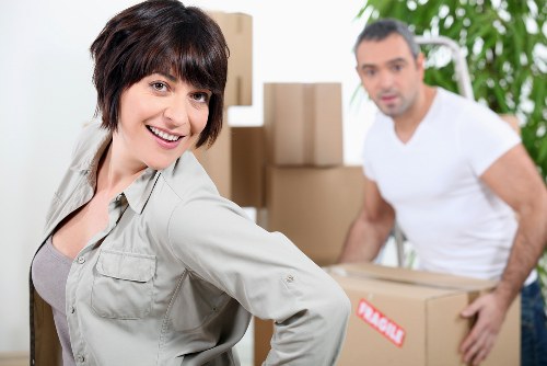 Moving team handling access challenges in a Chinatown apartment building